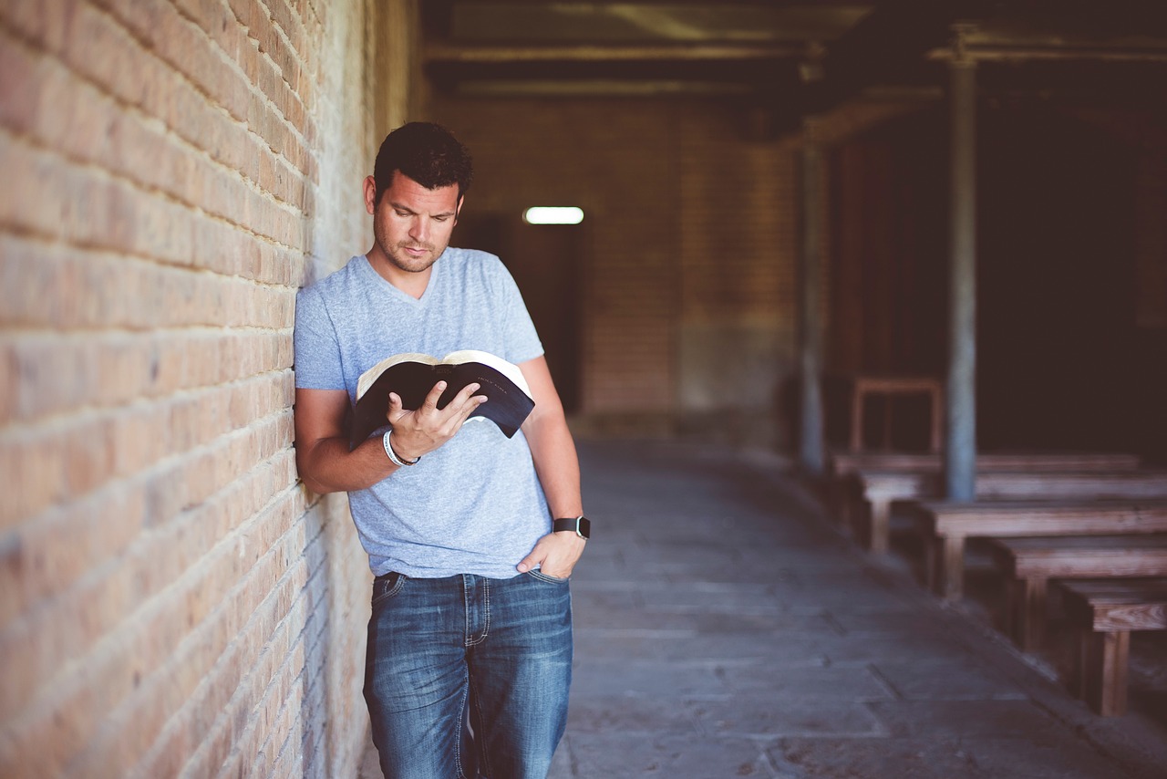 MAN READING BOOK 8